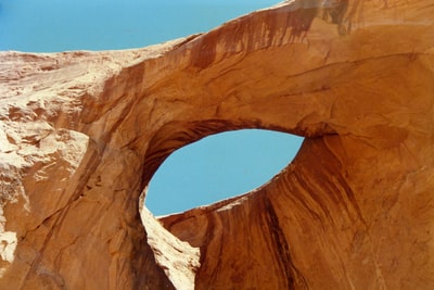 Brown rock strata under the blue sky during the day
